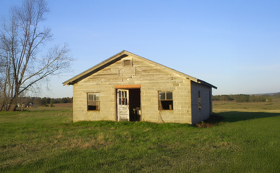 Kelly Seed Warehouse in Hartford, Alabama stone building golden hour countryside